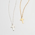 Mini Sterling Silver Cross Charm Necklace Mini sterling silver cross charm necklace on a fine chain