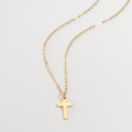 Mini Silver Cross Charm Necklace Mini sterling silver cross charm necklace gallery image