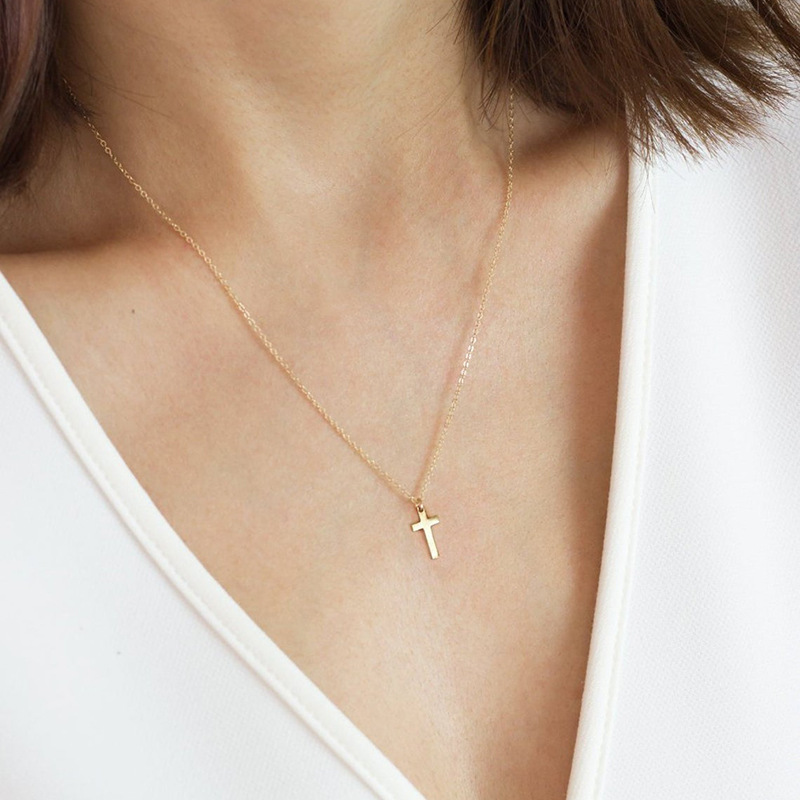 Mini Silver Cross Charm Necklace Mini sterling silver cross charm necklace gallery image