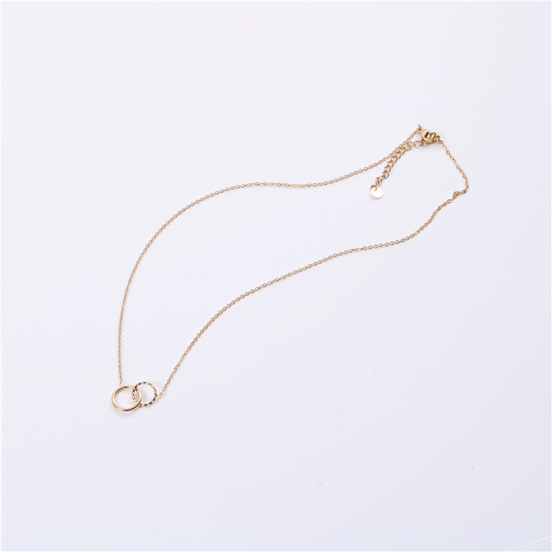 Interlocking Circles Necklace Interlocking circles necklace with a polished circle and hammered circle