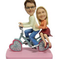 Bike Couple Figurine Couple figurine on a bike