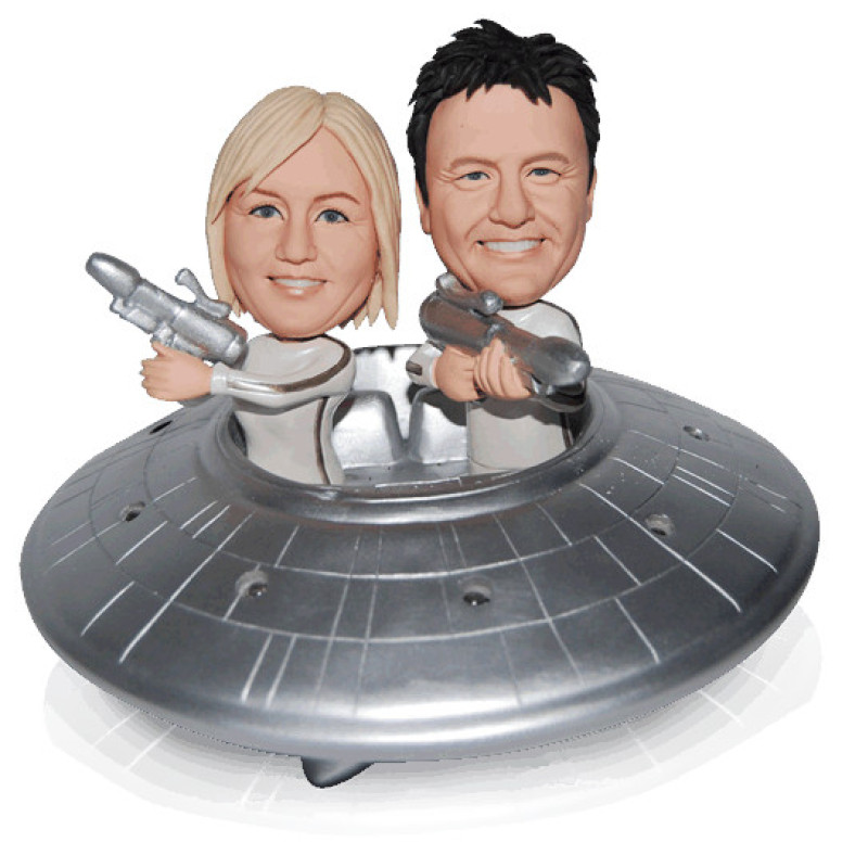 Flying Saucer Couple Figurine Couple figurine with flying saucer background