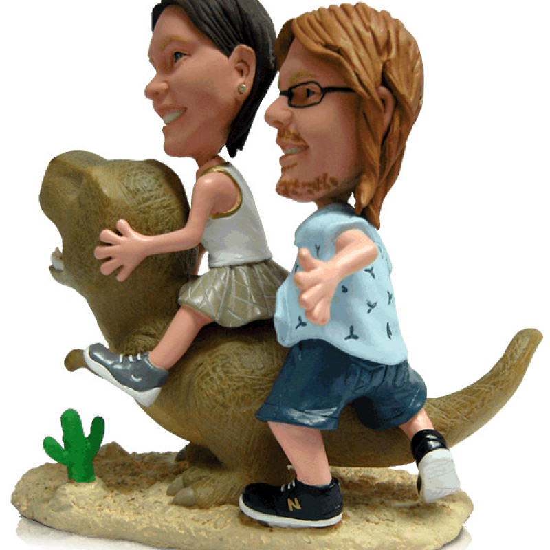Dinosaur Couple Figurine Couple figurine with dinosaur background