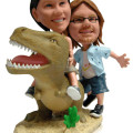 Dinosaur Couple Figurine Couple figurine with dinosaur background
