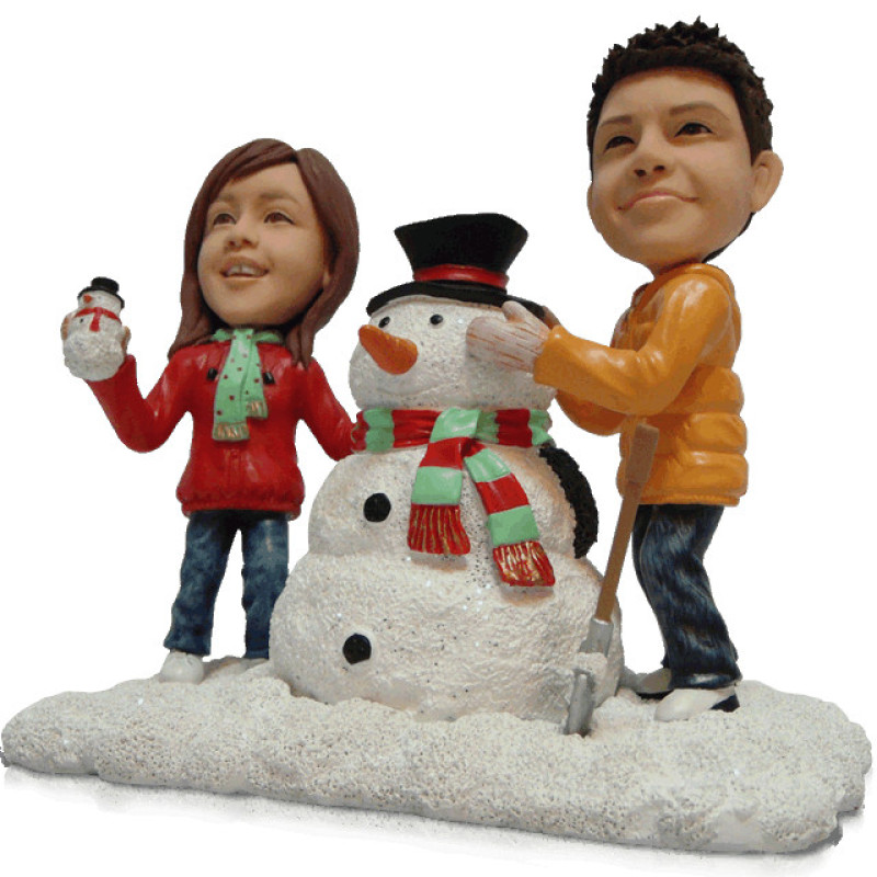 Snowman Couple Figurine Couple figurine with snowman background