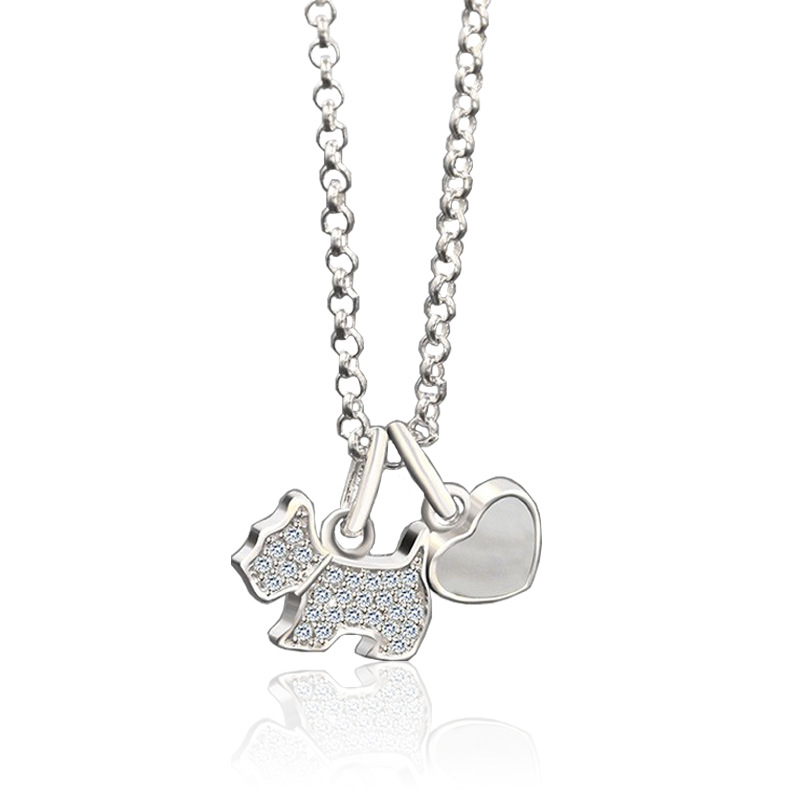 Sterling silver necklace featuring a zircon-studded dog pendant and polished onyx heart charm