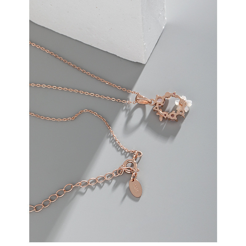 Rose gold flower wreath necklace with pink crystals and pearl