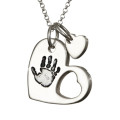 Sterling silver cut-out heart handprint necklace