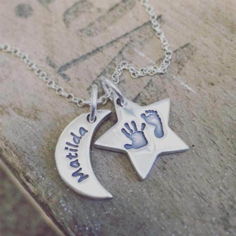 Moon & Star Necklace Lifestyle Image Moon and star personalised necklace shown in a lifestyle setting