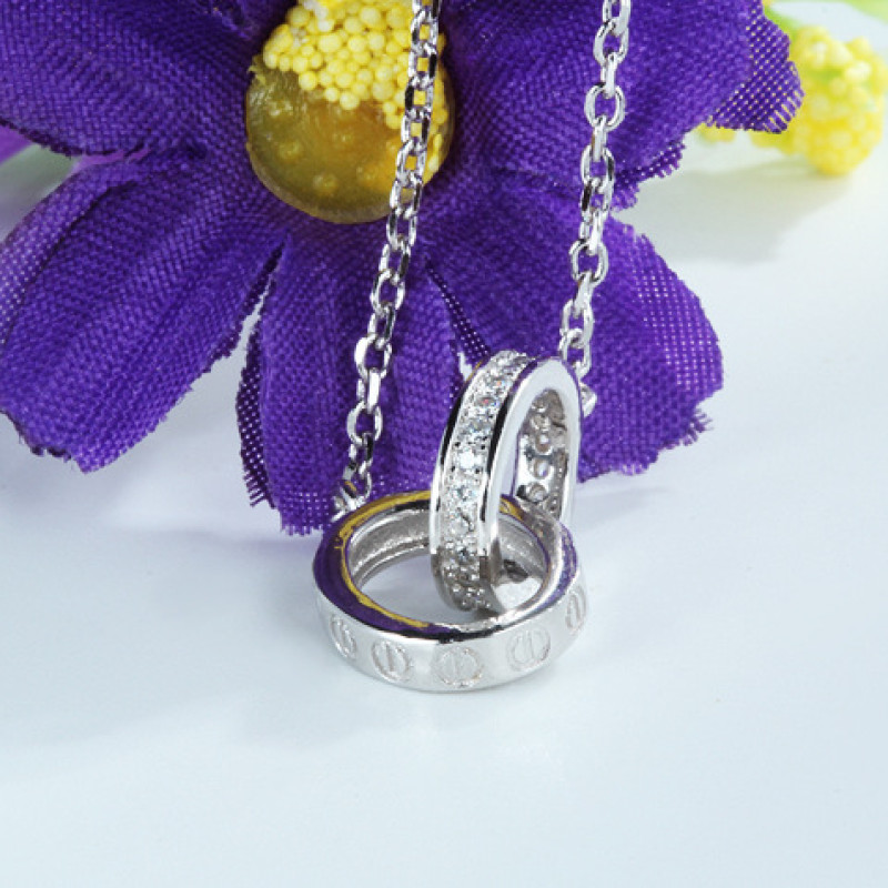 Interlocking Circles Necklace Interlocking circles necklace with a polished circle and hammered circle