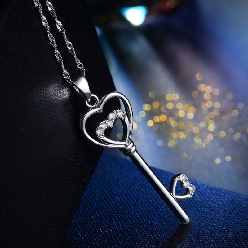 Sterling silver key pendant necklace with a double-heart detail