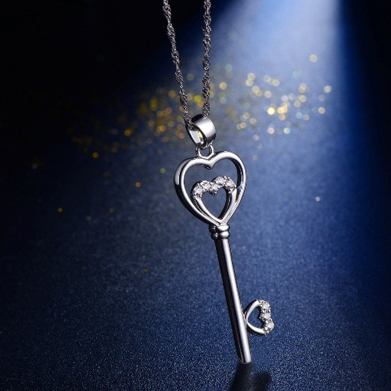 Sterling silver key pendant necklace with a double-heart detail