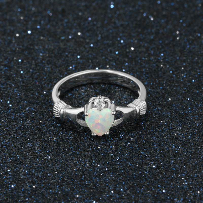 Sterling silver Claddagh ring with heart-cut synthetic white opal stone