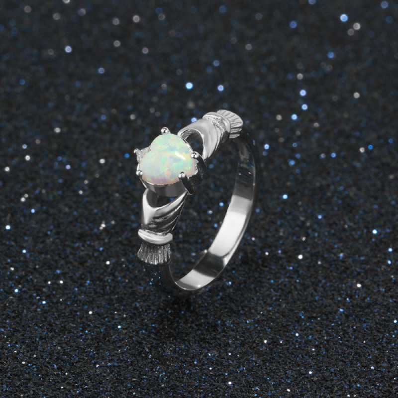 Sterling silver Claddagh ring with heart-cut synthetic white opal stone