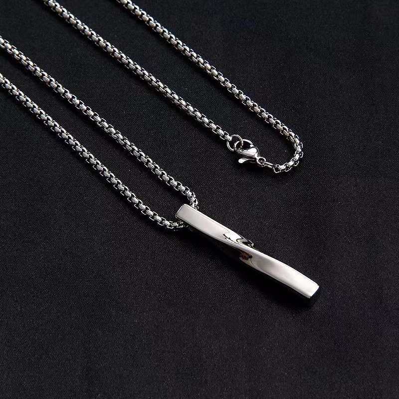 Long Man Silver Pendant – Geometric Möbius Strip Long Man Silver Pendant with geometric Möbius strip design