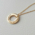 Personalised circle washer necklace with hand-stamped text