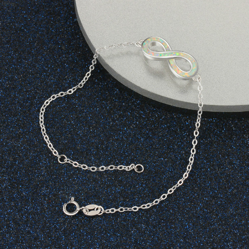 White Opal Infinity Bracelet in Sterling Silver White opal infinity bracelet with personalised engraving in sterling silver