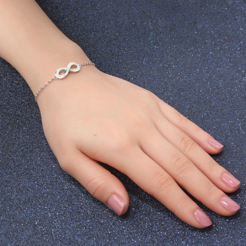 White Opal Infinity Bracelet in Sterling Silver White opal infinity bracelet with personalised engraving in sterling silver