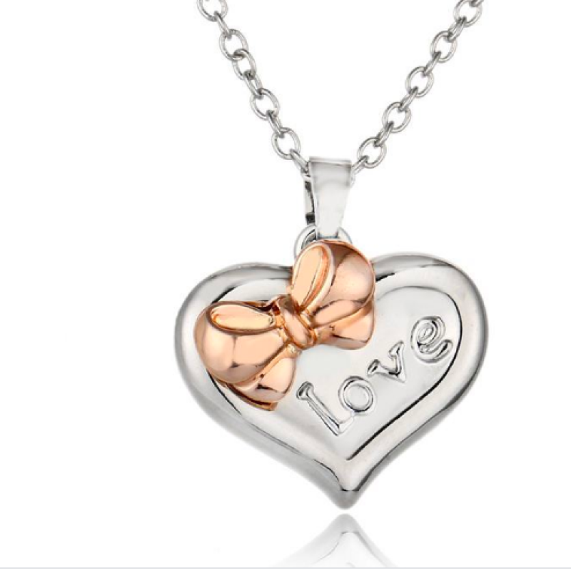 Personalised Two-Coloured Heart Bow Necklace Personalised two-coloured heart necklace with bow detail