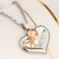 Personalised Two-Coloured Heart Bow Necklace Personalised two-coloured heart necklace with bow detail