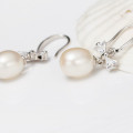 Freshwater Pearl Bow Earrings Freshwater pearl earrings with bows on sterling silver hooks