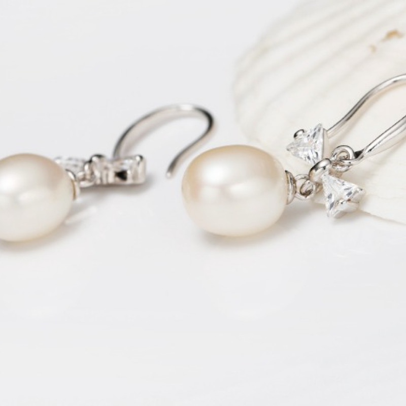 Freshwater Pearl Bow Earrings Freshwater pearl earrings with bows on sterling silver hooks