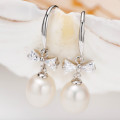 Freshwater Pearl Bow Earrings Freshwater pearl earrings with bows on sterling silver hooks