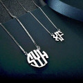 Round monogram initial necklace with a cut-out scripted pendant