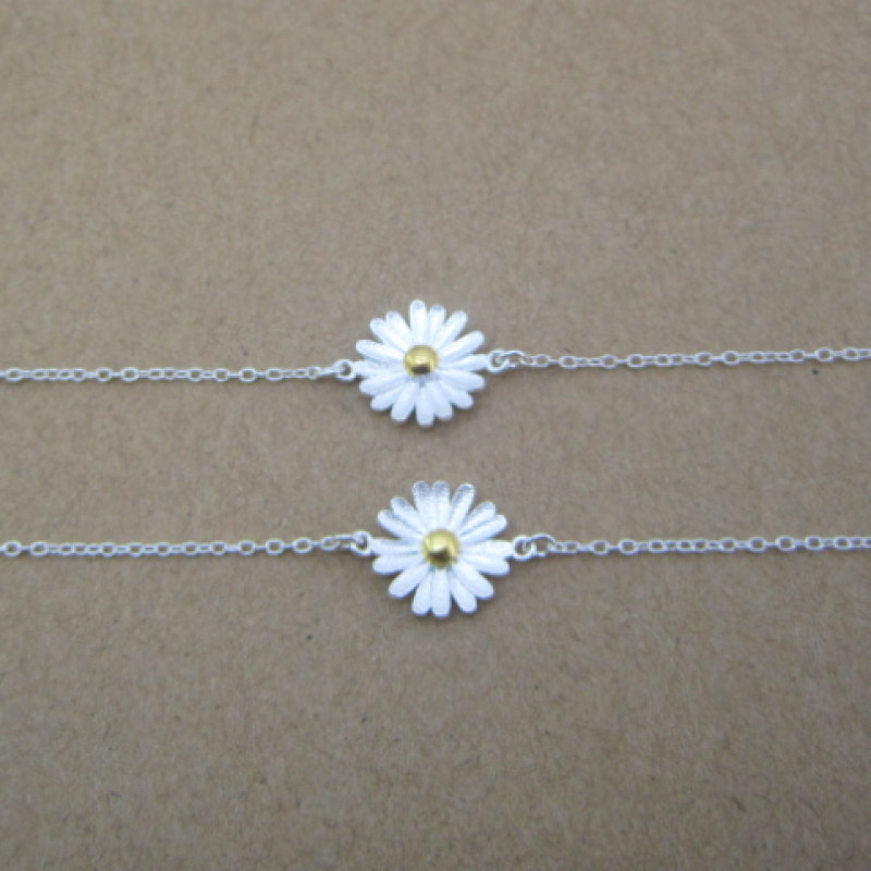 Dainty Sterling Silver Sunflower Bracelet Dainty sunflower bracelet with a yellow gold-coloured centre on a silver chain