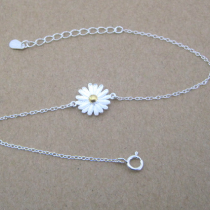 Dainty Sterling Silver Sunflower Bracelet Dainty sunflower bracelet with a yellow gold-coloured centre on a silver chain