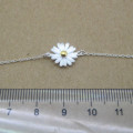 Dainty Sterling Silver Sunflower Bracelet Dainty sunflower bracelet with a yellow gold-coloured centre on a silver chain