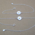 Dainty Sterling Silver Sunflower Bracelet Dainty sunflower bracelet with a yellow gold-coloured centre on a silver chain