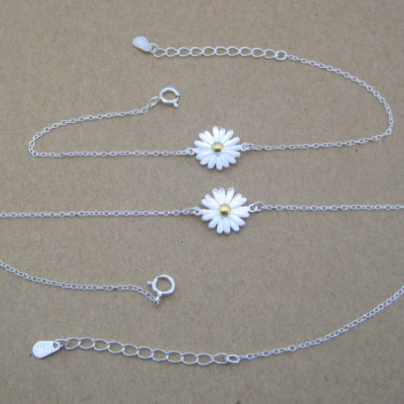 Dainty Sterling Silver Sunflower Bracelet Dainty sunflower bracelet with a yellow gold-coloured centre on a silver chain
