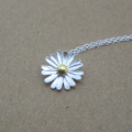 Dainty sunflower necklace with a matte-pattern pendant and yellow-gold-plated centre