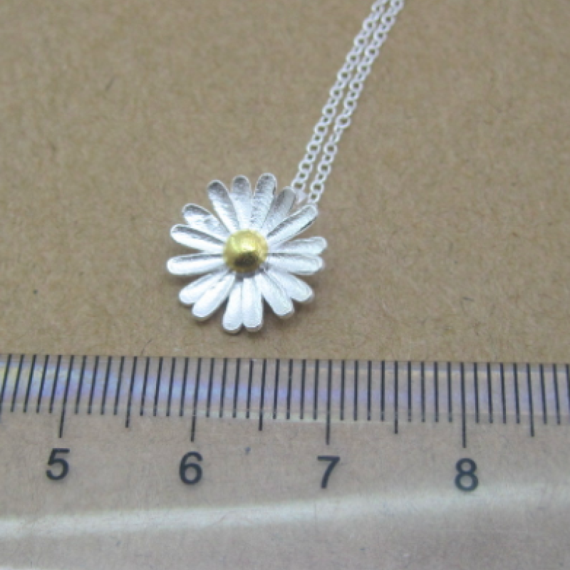 Dainty sunflower necklace with a matte-pattern pendant and yellow-gold-plated centre