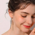 Long tassel drop earrings with geometric pendants