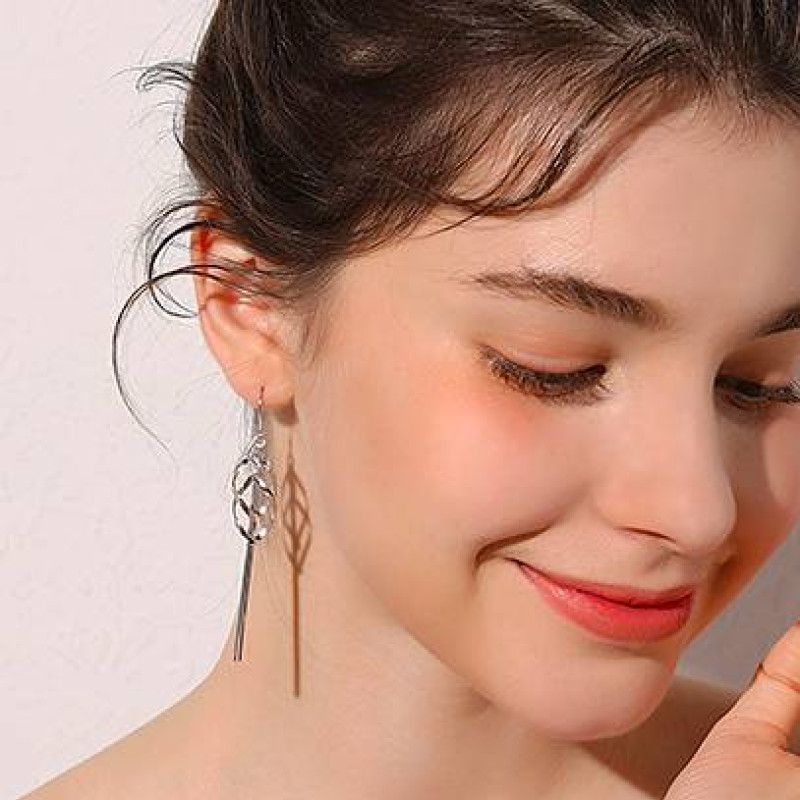 Long tassel drop earrings with geometric pendants