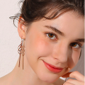 Long tassel drop earrings with geometric pendants