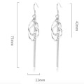 Long tassel drop earrings with geometric pendants