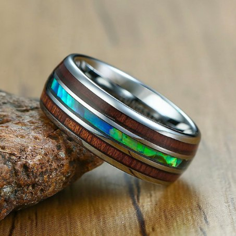 Side view of tungsten Koa wood barrel style eternity ring