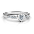Bezel set love ring with a heart-cut centre stone and accent stones