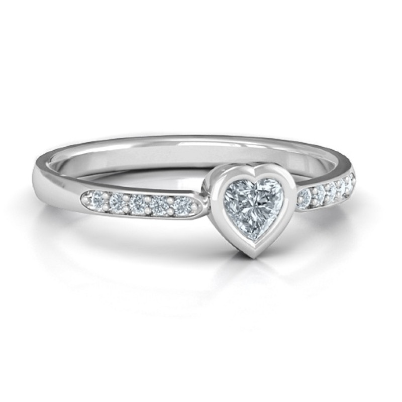 Bezel set love ring with a heart-cut centre stone and accent stones