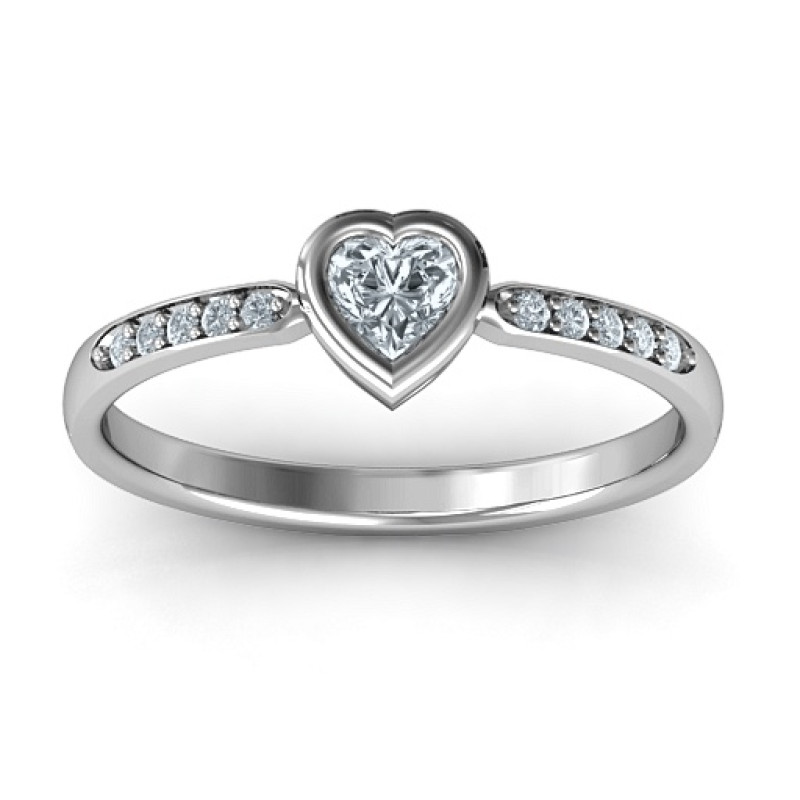Bezel set love ring with a heart-cut centre stone and accent stones