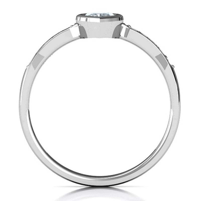 Bezel set love ring with a heart-cut centre stone and accent stones