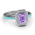 Emerald cut halo cocktail ring with round accent stones