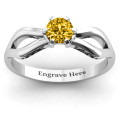 Fancy split shank solitaire ring with a round centre stone