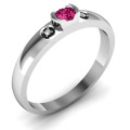 Open bezel ring with round centre stone and two accent stones
