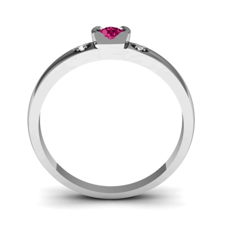 Open bezel ring with round centre stone and two accent stones