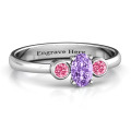 Oval centre ring with twin bezel round side stones