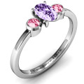 Oval centre ring with twin bezel round side stones